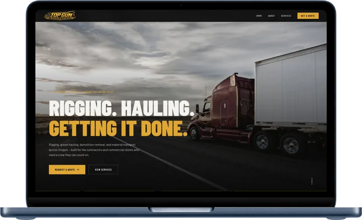 Top Gun Trucking and Rigging website shown on a laptop